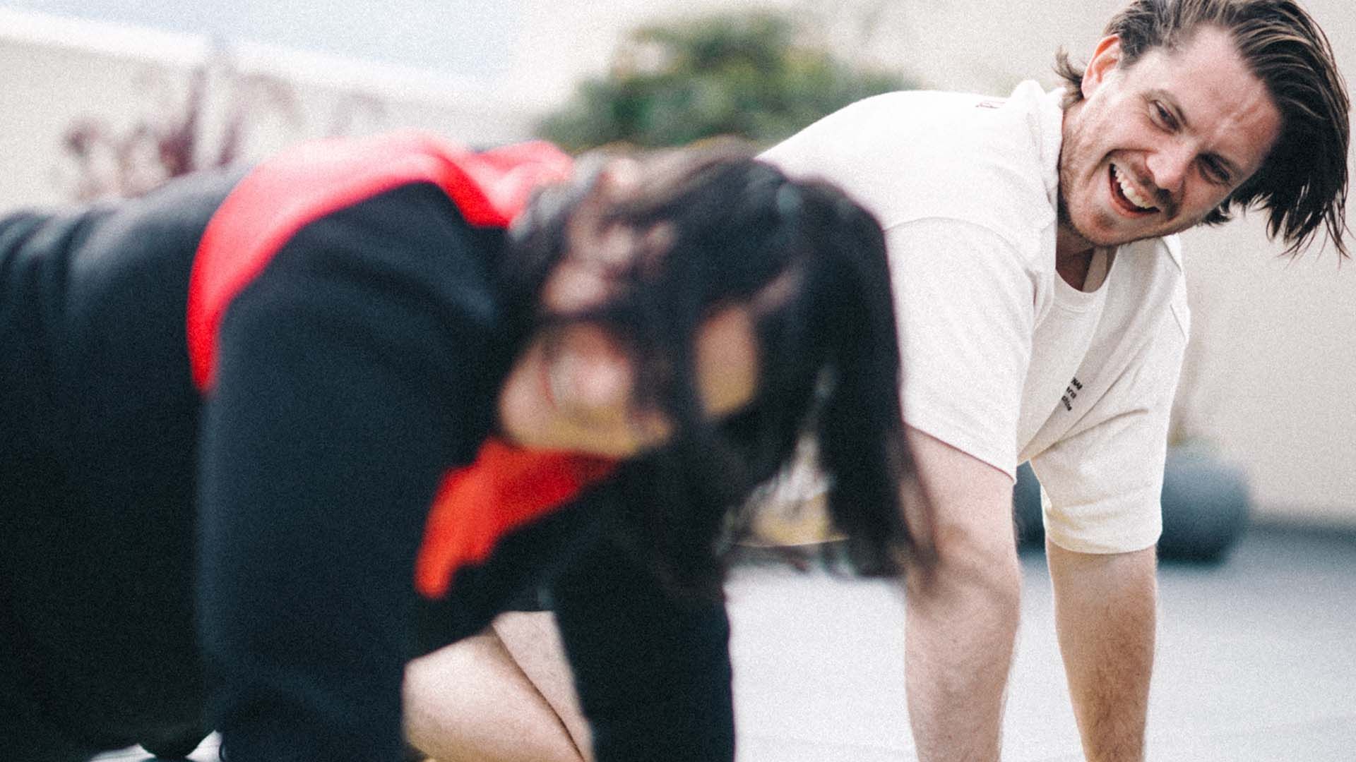 Photo of two people performing push-ups.