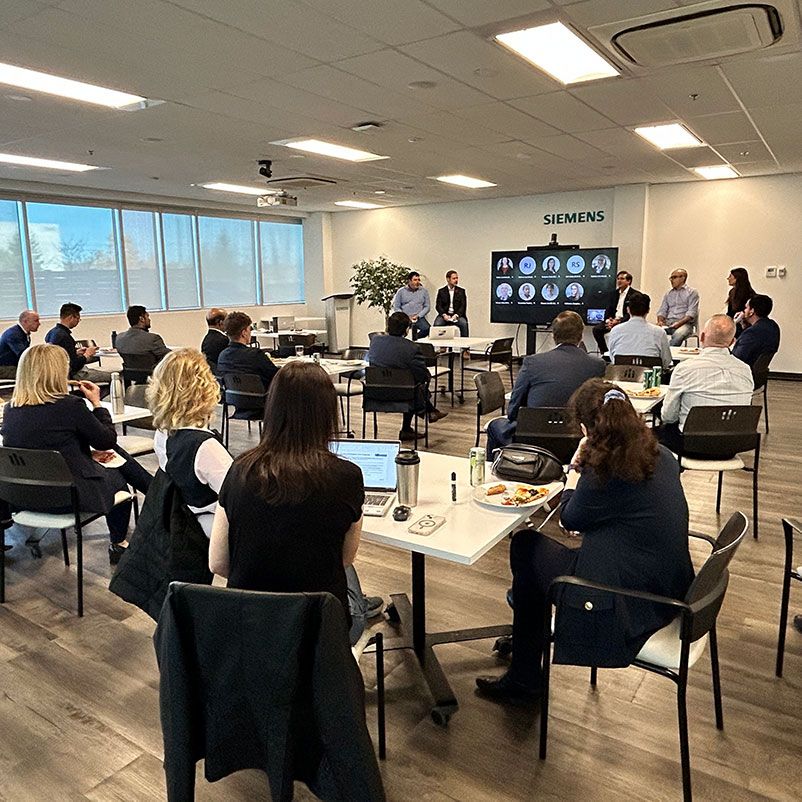 Photo of group of office workers attending an information session.