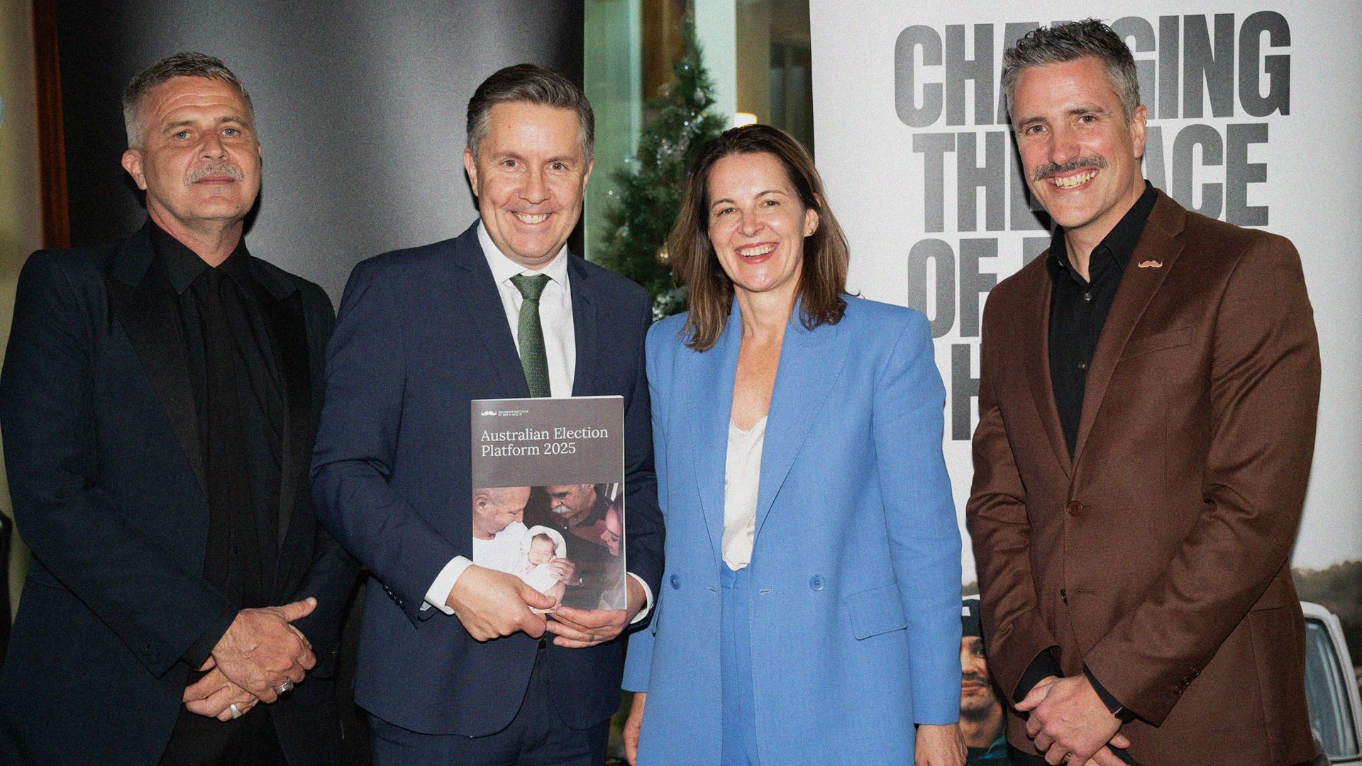 Movember Founder, CEO, and Global Director of Movember Institute of Men's Health pose with Hon Mark Butler MP, Minister for Health and Aged Care