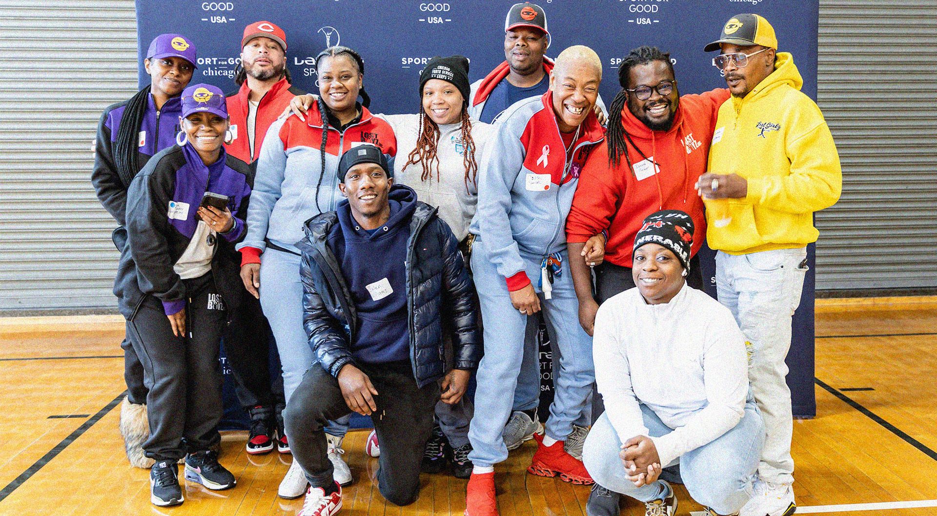 Photo of a group of youth, posing and smiling to camera.