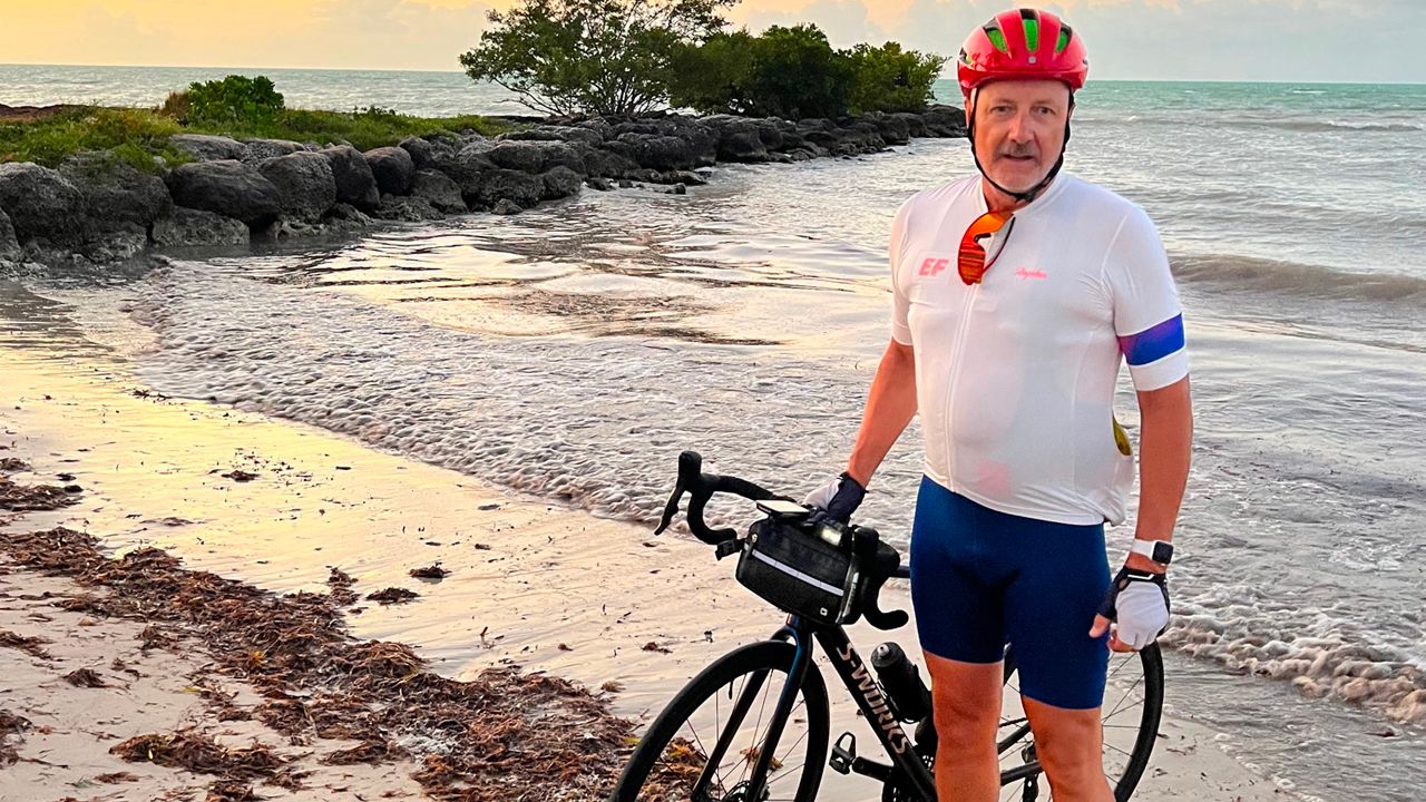 Man with Bike at Ocean