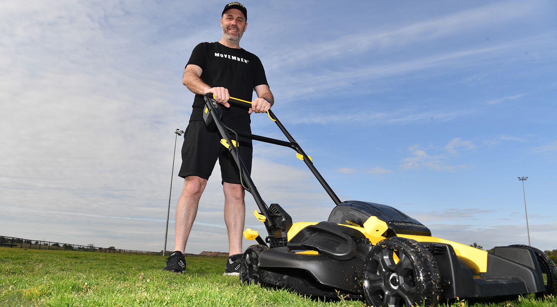 Mo Bro Bradley poses with lawn mower