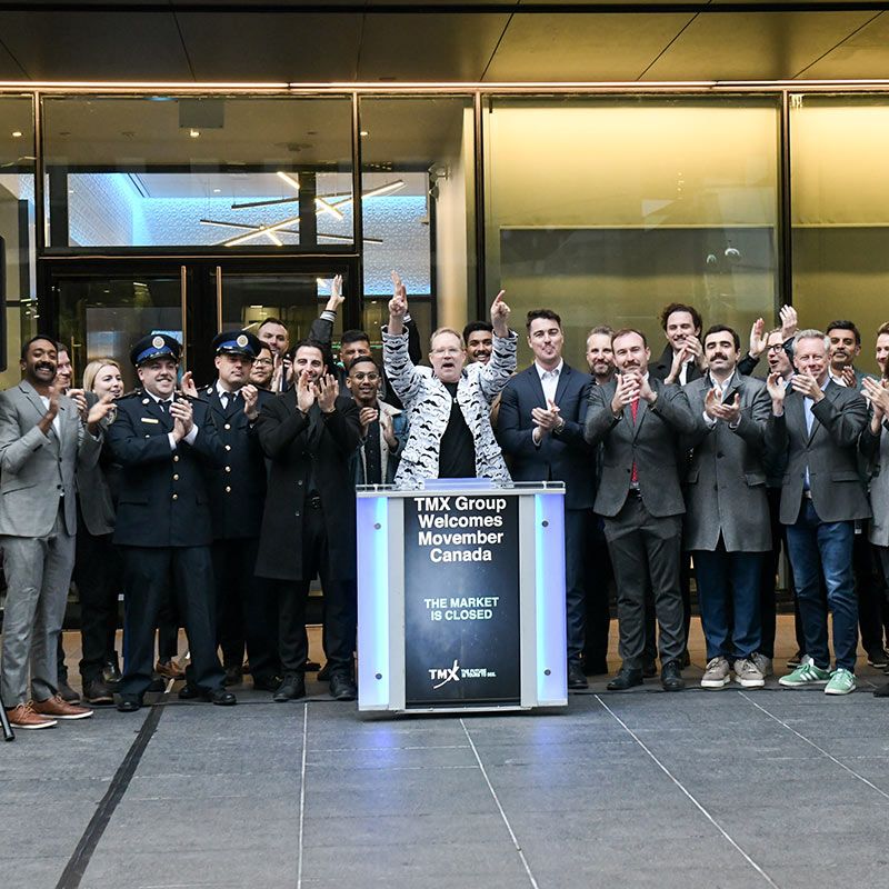 Photo of Movember personnel closing the Toronto Stock Exchange.
