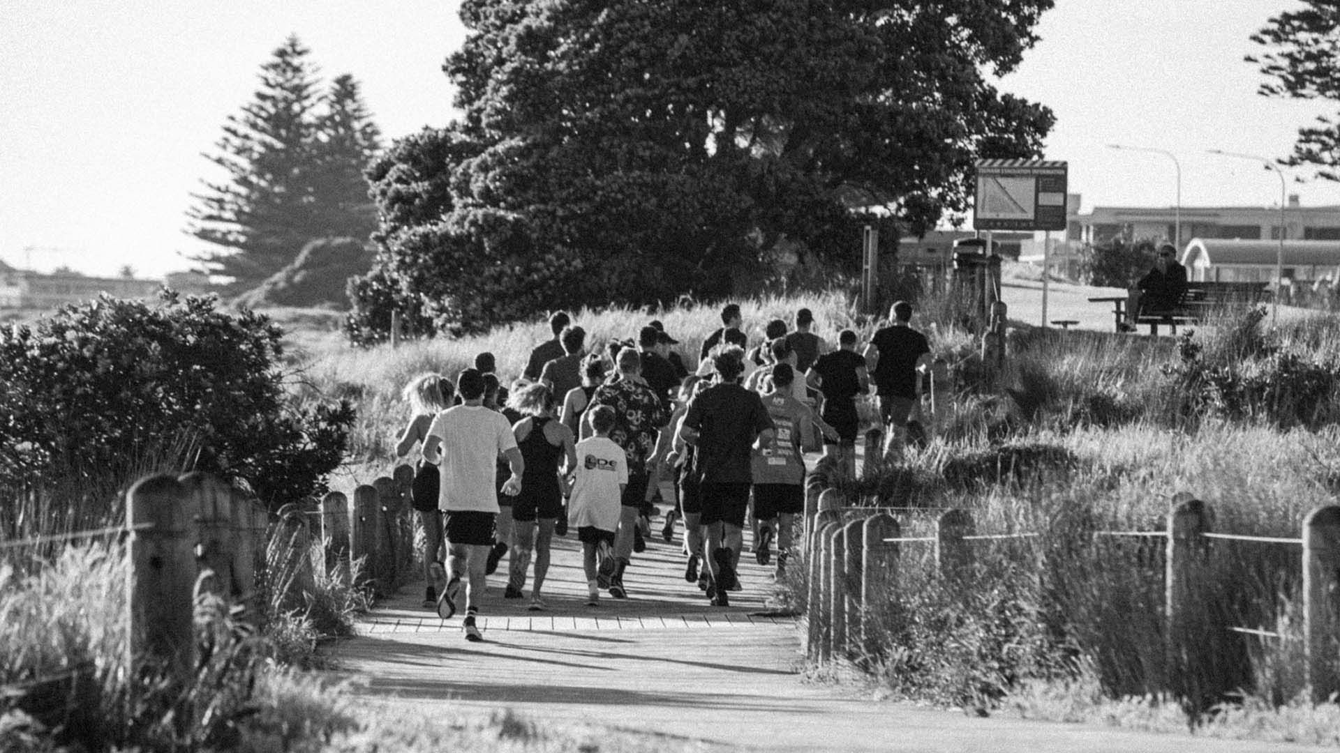 Black and white photo of running group setting off for a run.