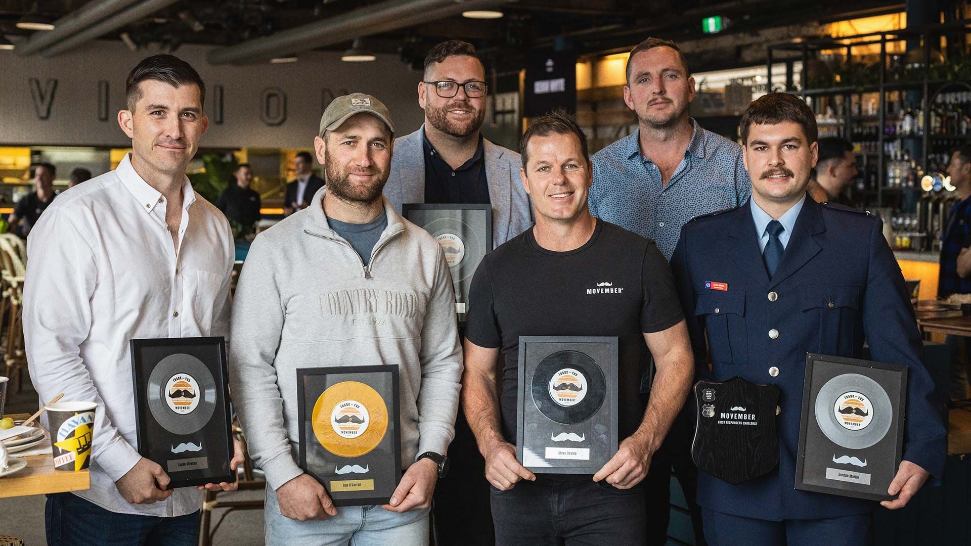 Hall of Famers with their Movember trophies.