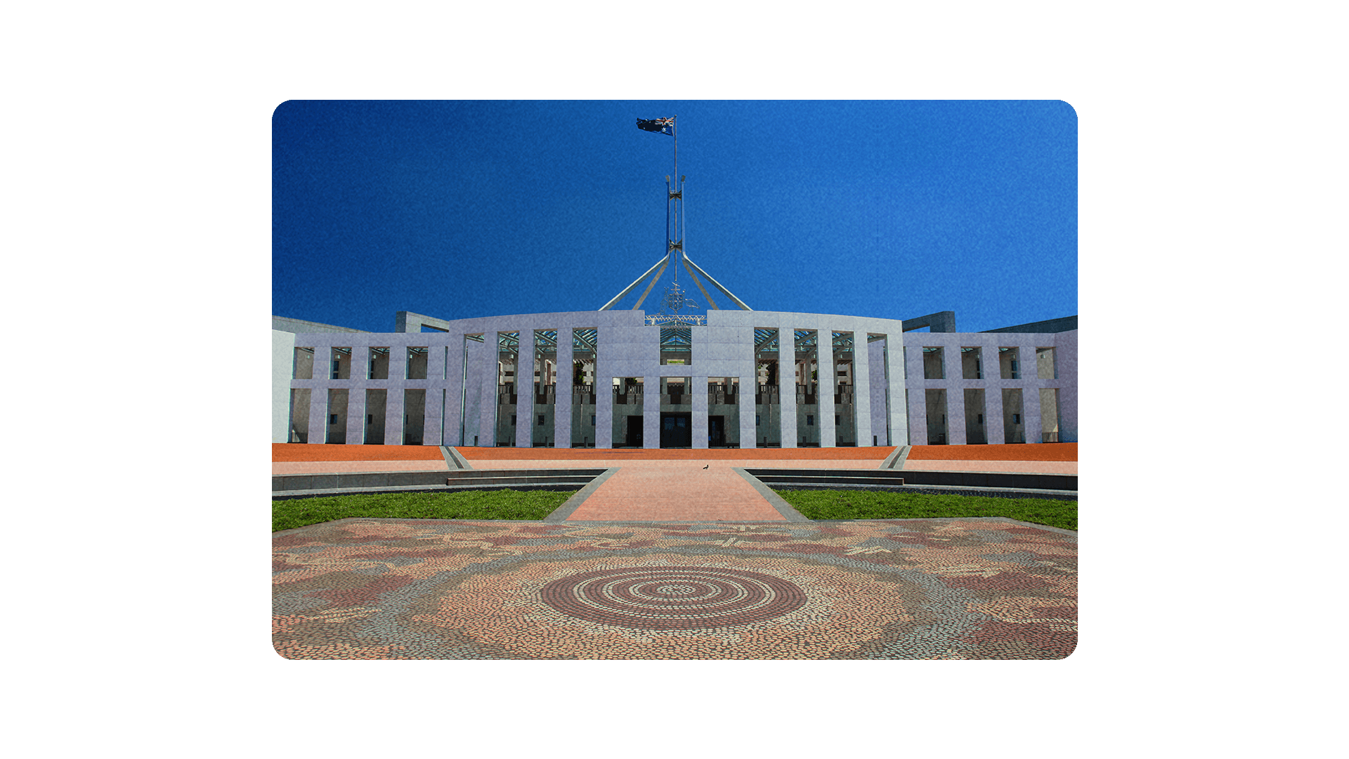 Australia's Parliament House with Aboriginal artwork displayed on the ground.