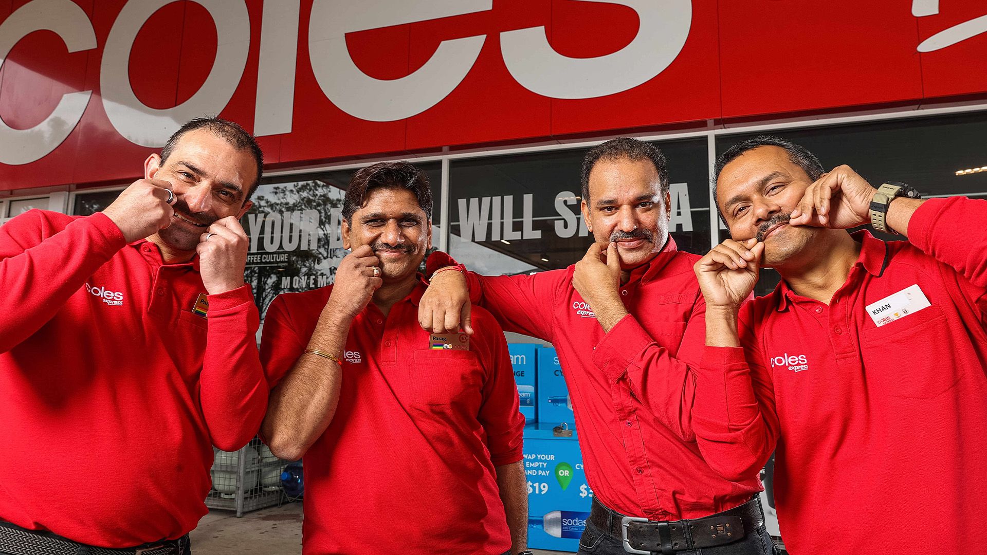 An image of four Coles Express employees twirling their moustaches.