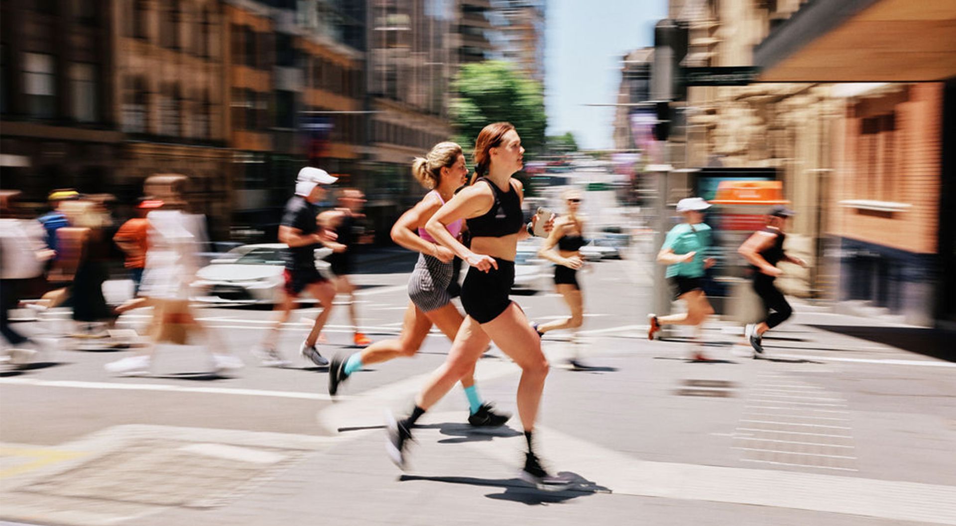 Runners moving in fast sequence image through Sydney CBD.