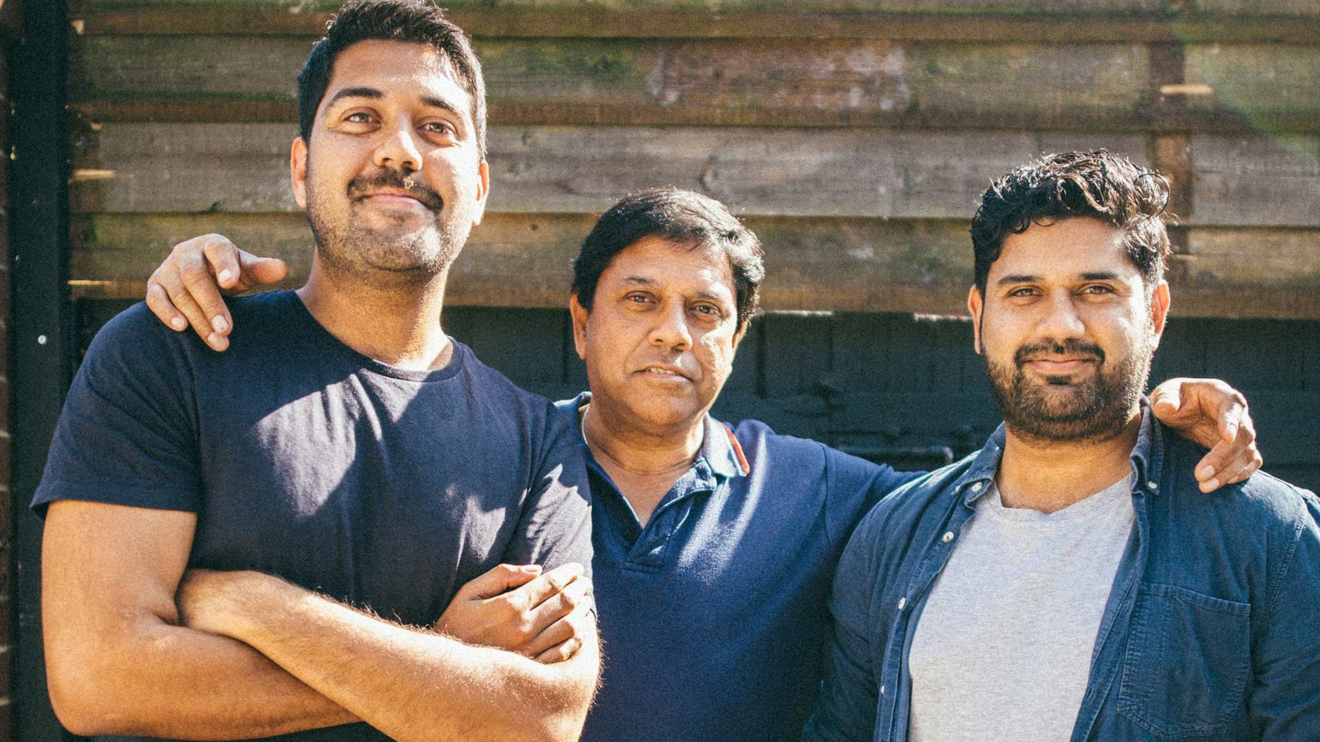 Photo of a family standing together.