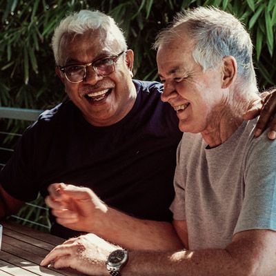 Photo of two smiling men.