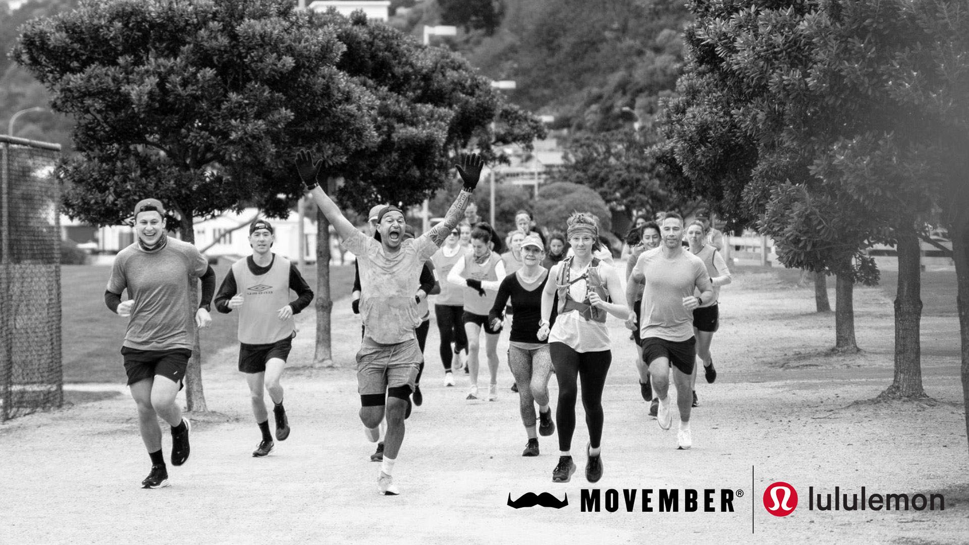 Black and white photo of running group, joyously approaching camera.
